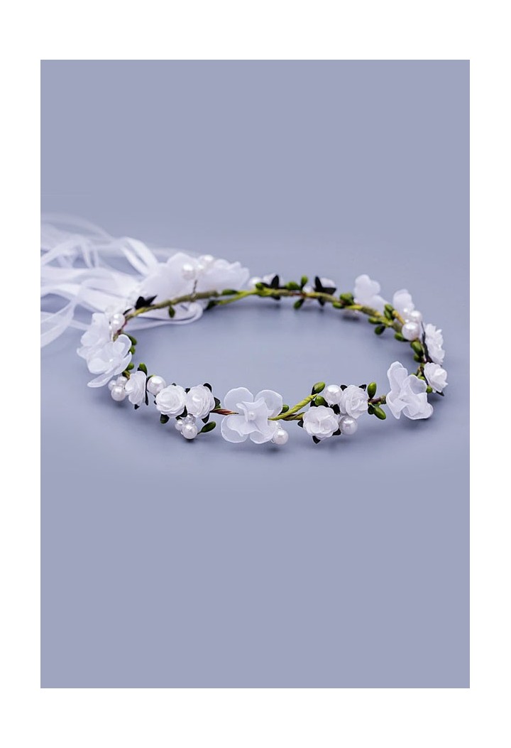 delicate garland with white flowers and green elements and beautiful ribbons on the back