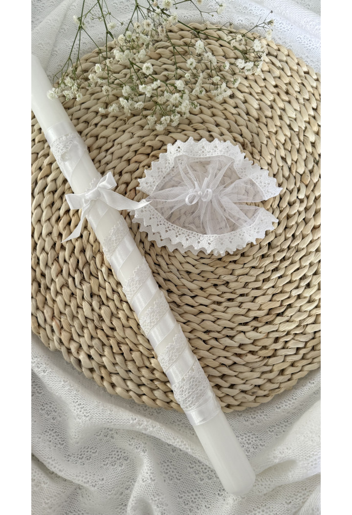 A classic christening candle – white, decorated with lace and ribbon.