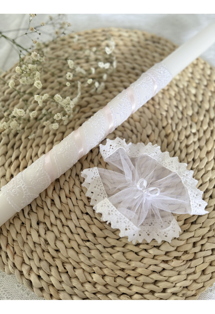 A classic christening candle – pink, decorated with lace and ribbon.